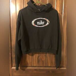 Nike Black Woman’s hoodie.  With Embroidered Nike Flowered Logo